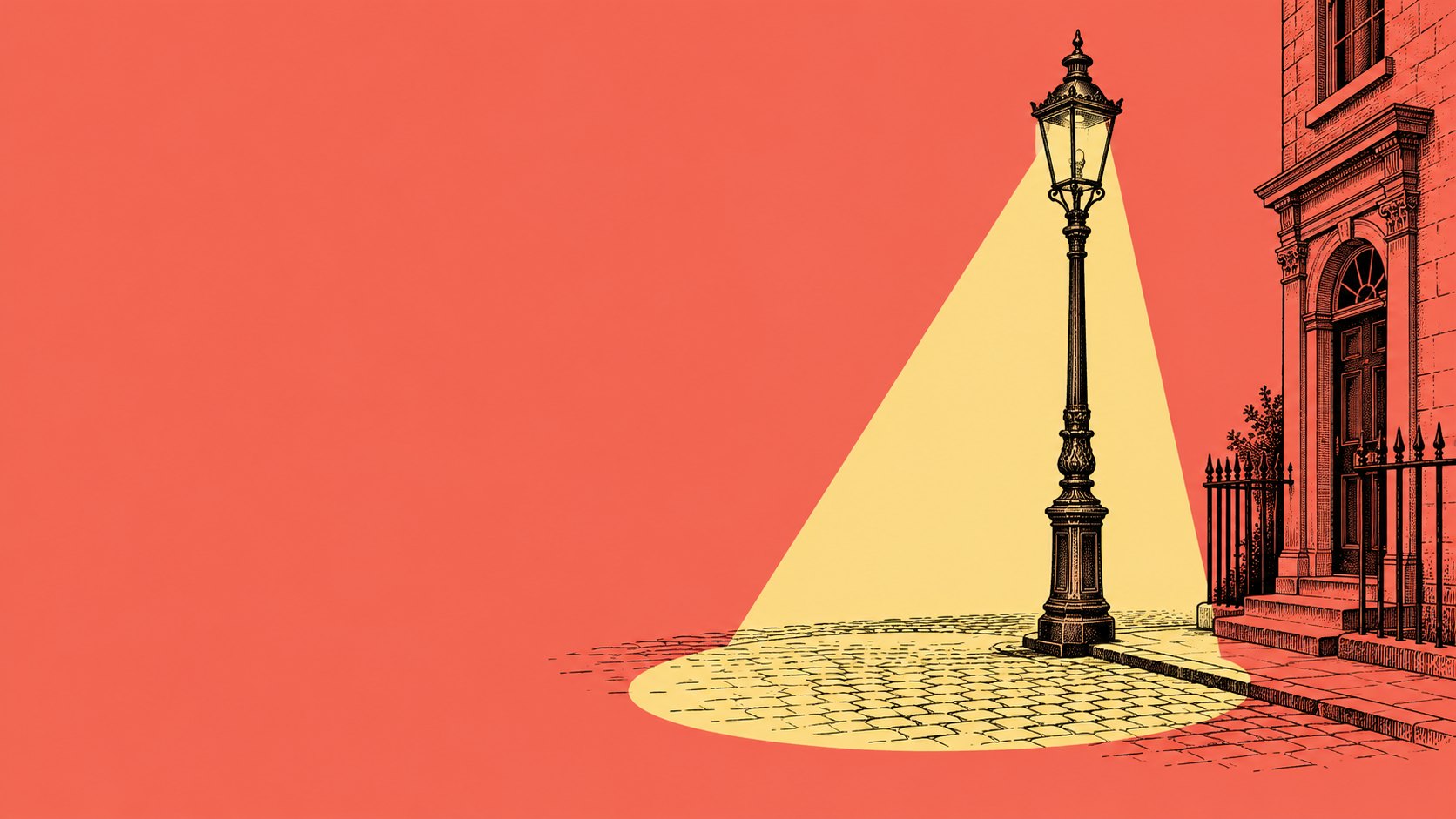 An engraved street lamp casting a warm pool of light on cobblestones